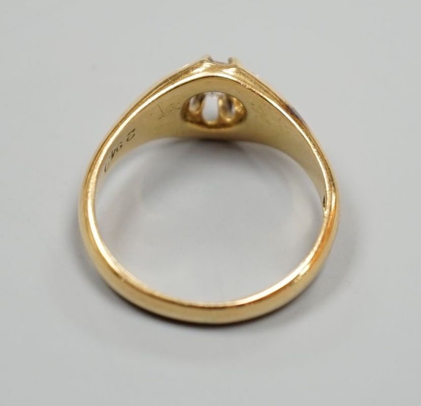 An Edwardian 18ct gold and claw set solitaire diamond ring, size N, gross weight 4.8 grams.